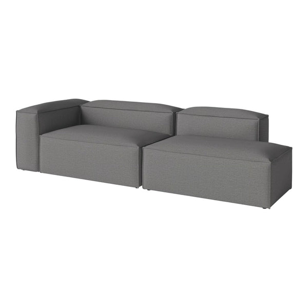 "Modern gray sectional sofa with sleek, solid upholstery and minimalistic design, perfect for contemporary living spaces."