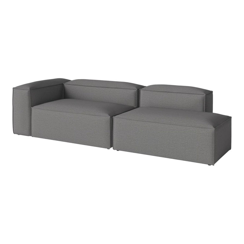 "Modern gray sectional sofa with sleek, solid upholstery and minimalistic design, perfect for contemporary living spaces."
