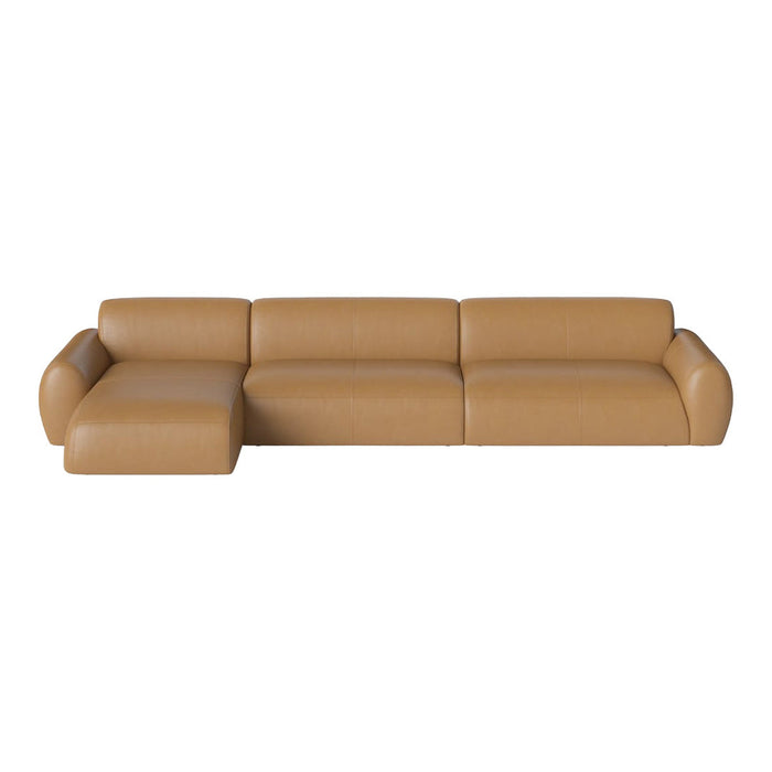 Tan leather sectional sofa with a sleek, modern design and smooth, minimal patterns.