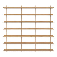 Light oak wood shelving unit with a minimalist design featuring multiple horizontal and vertical shelves.