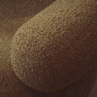Tan textured fabric with a soft, plush surface and subtle, irregular pattern. Ideal for cozy decor.
