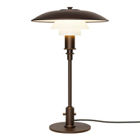 Bronze table lamp with layered white glass shade, showcasing a modern, minimalist design.