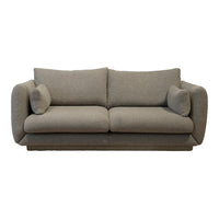 Textured grey upholstered sofa with plush cushions, perfect for modern and cozy living spaces.