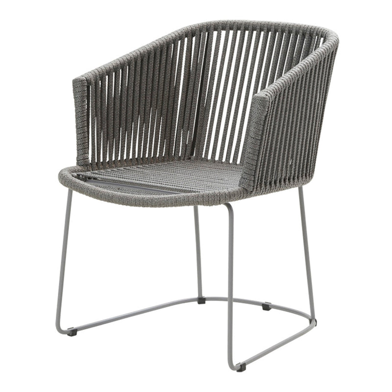 Gray woven chair with a modern ribbed pattern and sleek metal frame, perfect for contemporary decor.