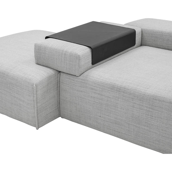 Gray textured fabric sofa with a sleek black leather accent table. Modern and minimalist design.
