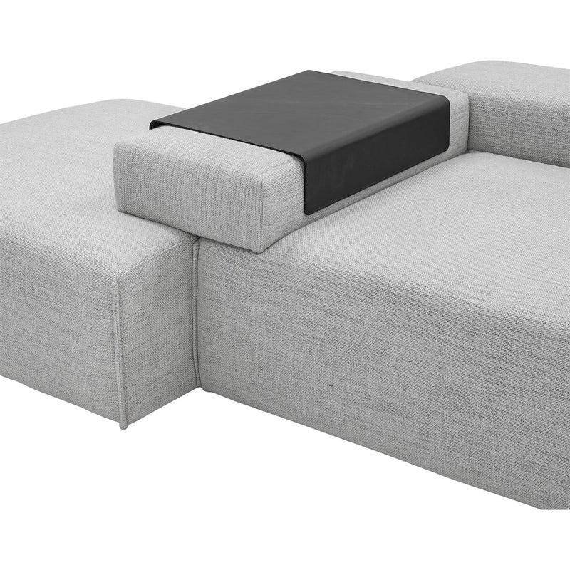 Gray textured fabric sofa with a sleek black leather accent table. Modern and minimalist design.