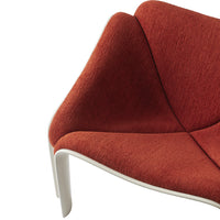 Red textured fabric chair detail with a sleek white base. Modern design showcasing a bold color contrast.