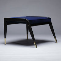 Navy blue velvet upholstered stool with sleek black legs and gold accents, featuring a modern, minimalist design.