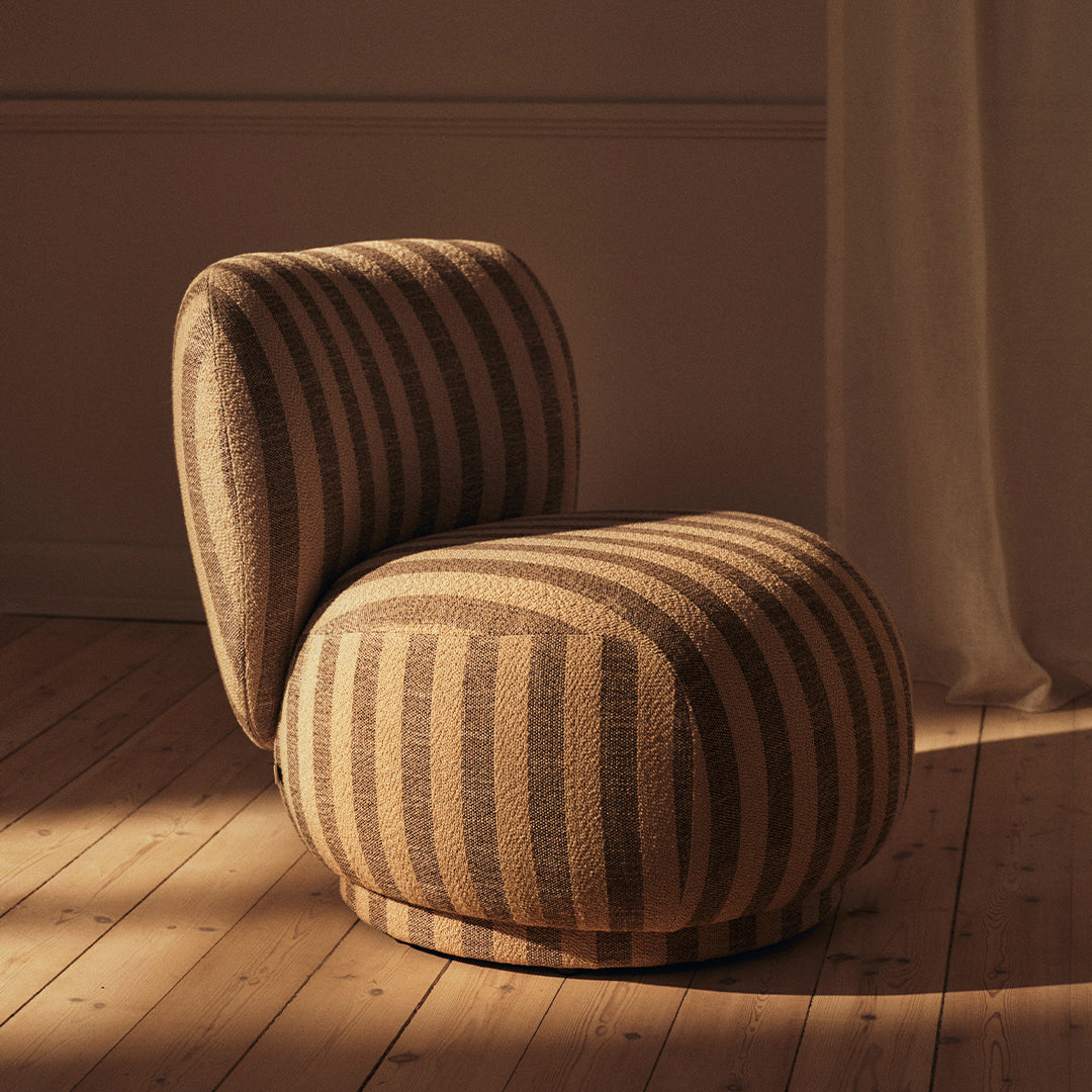 Brown and beige striped accent chair with a rounded design, perfect for a stylish modern interior.