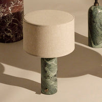 Green marble lamp with a beige fabric shade, featuring subtle veining and a smooth finish. Elegant home decor accent.