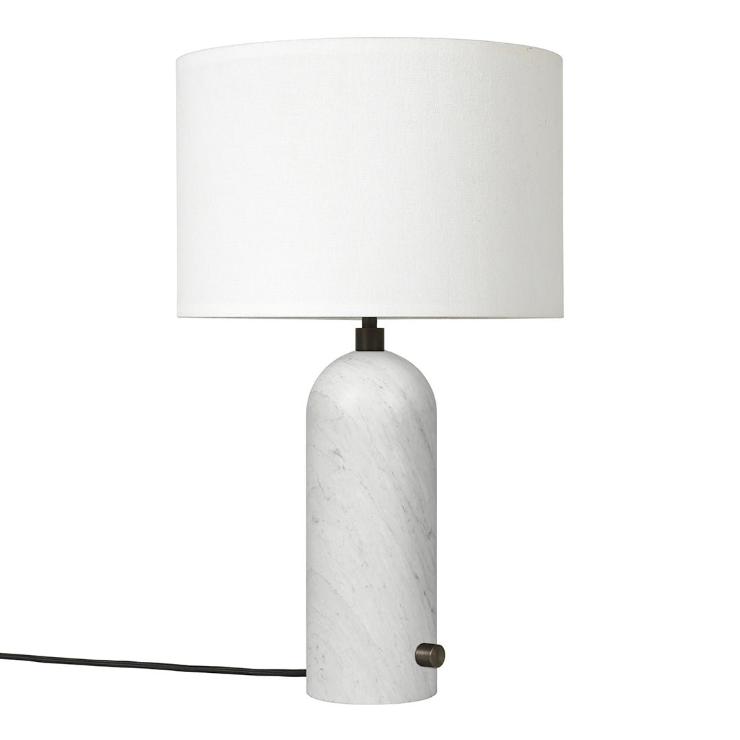White marble lamp with a smooth, cylindrical base and a simple white drum shade. Elegant and modern design.