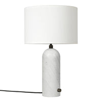 White marble lamp with a smooth, cylindrical base and a simple white drum shade. Elegant and modern design.