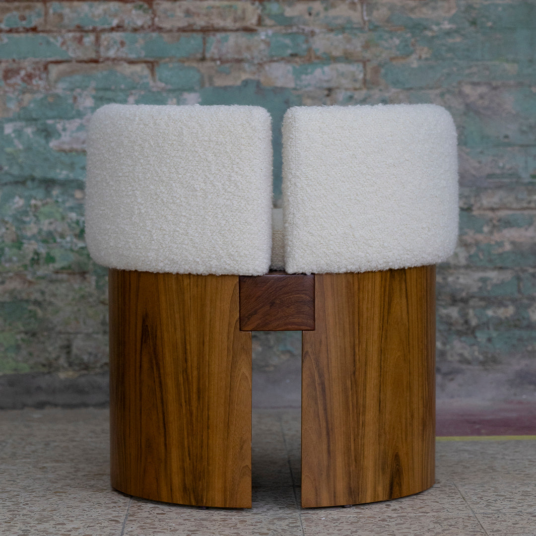 Round wooden stool featuring soft white cushioned seats and a warm wood grain finish. Modern and stylish design.