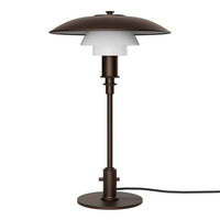 Elegant bronze lamp with a layered white glass shade, featuring smooth curves and modern design. Perfect for stylish decor.