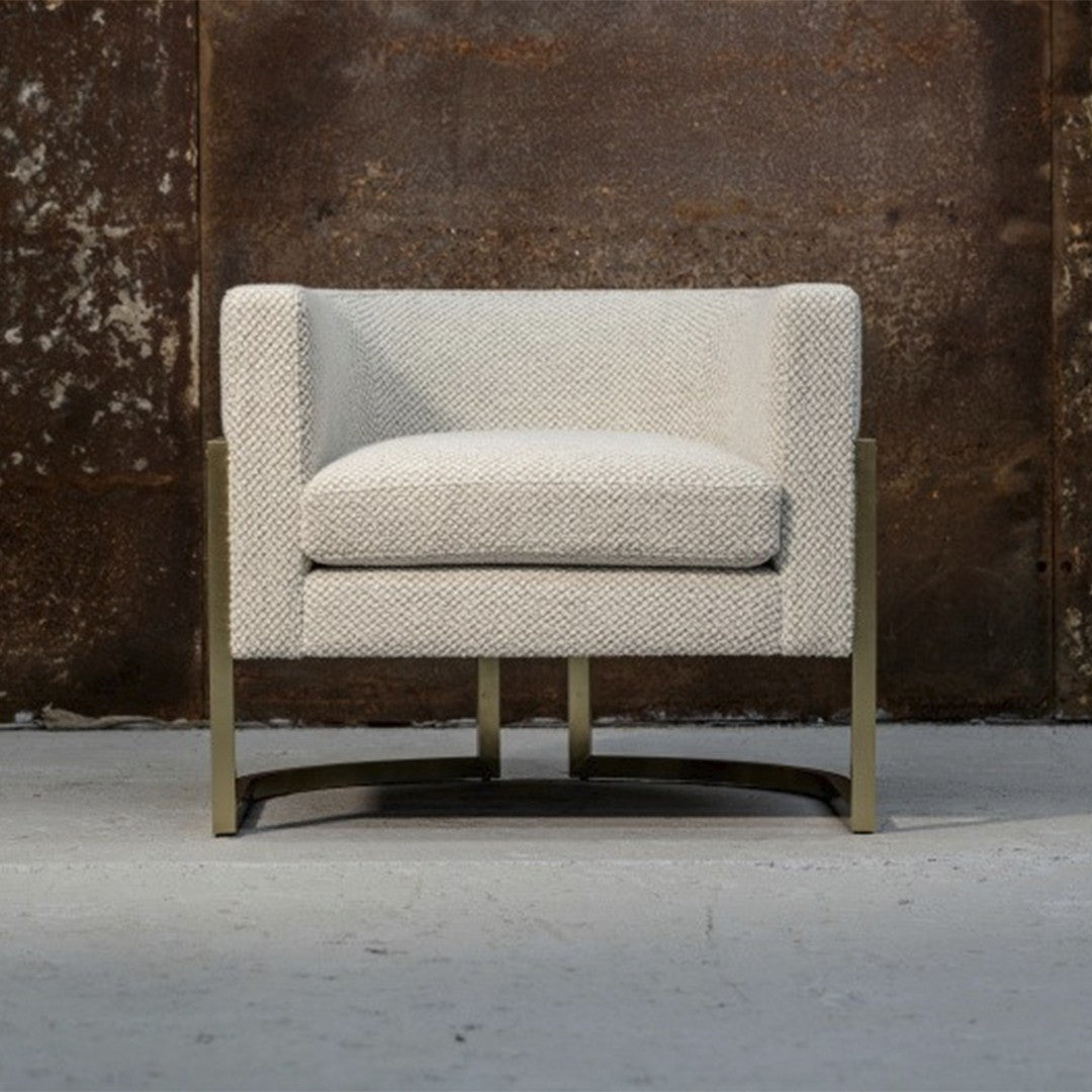 Light gray upholstered armchair with subtle textured pattern and sleek metallic legs, perfect for modern decor.