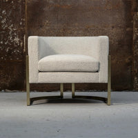 Light gray upholstered armchair with subtle textured pattern and sleek metallic legs, perfect for modern decor.