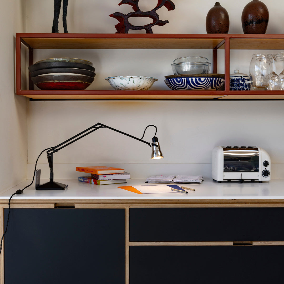 "Modern home decor featuring black, white, and blue patterns in a stylish shelving arrangement."