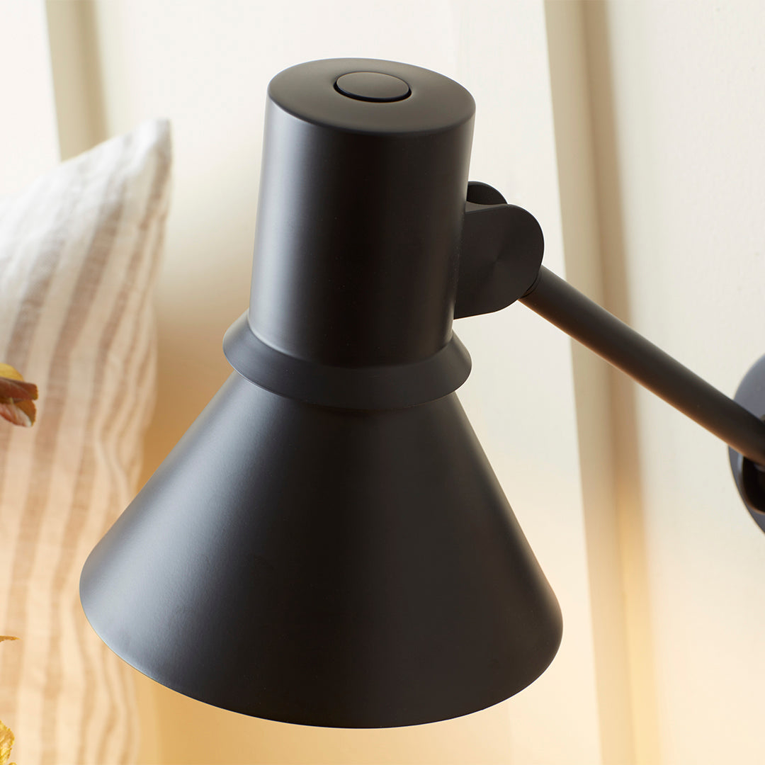 Black cone-shaped lamp shade with a matte finish, featuring sleek design and clean lines for modern decor.