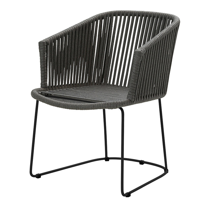 Black woven chair with a minimalist design and sleek metal frame, featuring a modern striped pattern.