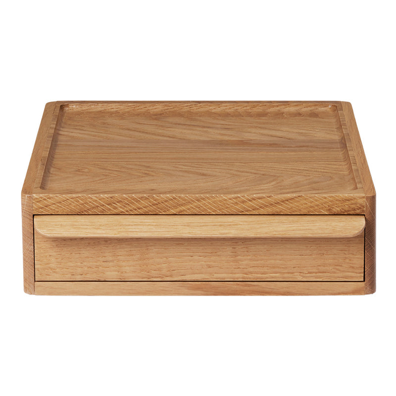 Natural wood drawer organizer in light oak with a smooth, minimalist design and subtle grain patterns.