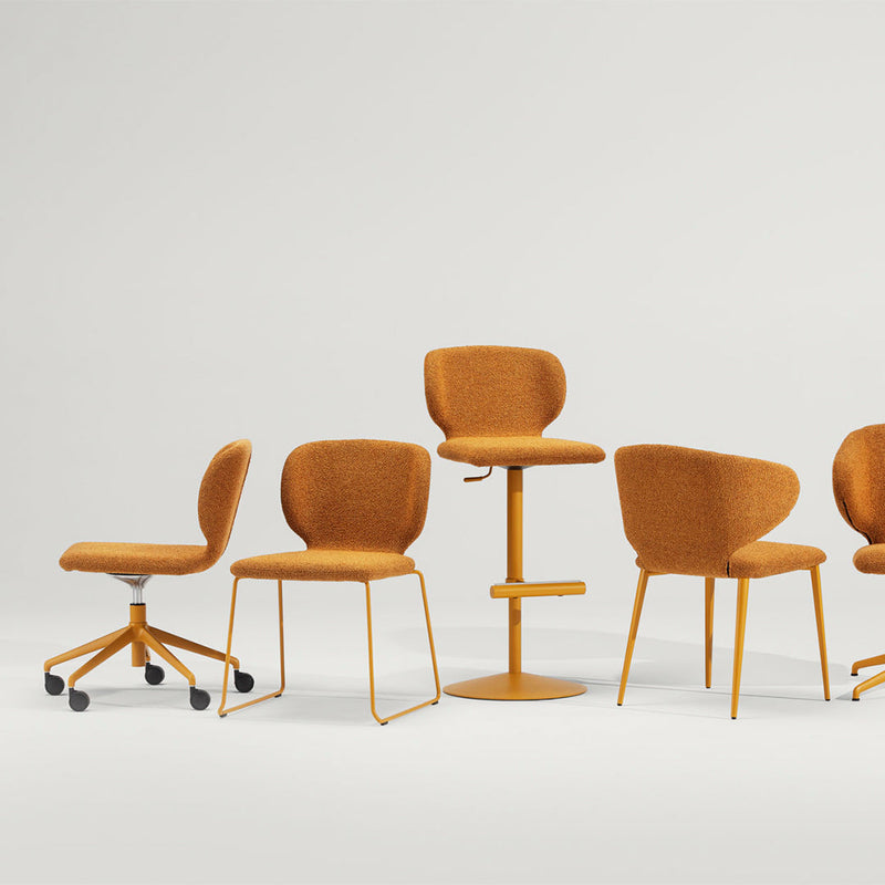 "Set of modern chairs in vibrant mustard yellow with sleek, minimalist design, featuring various shapes and textures."