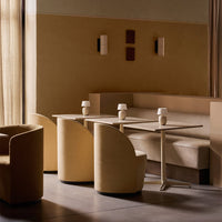 Neutral beige tones with smooth textures and minimalistic design in a modern café setting.