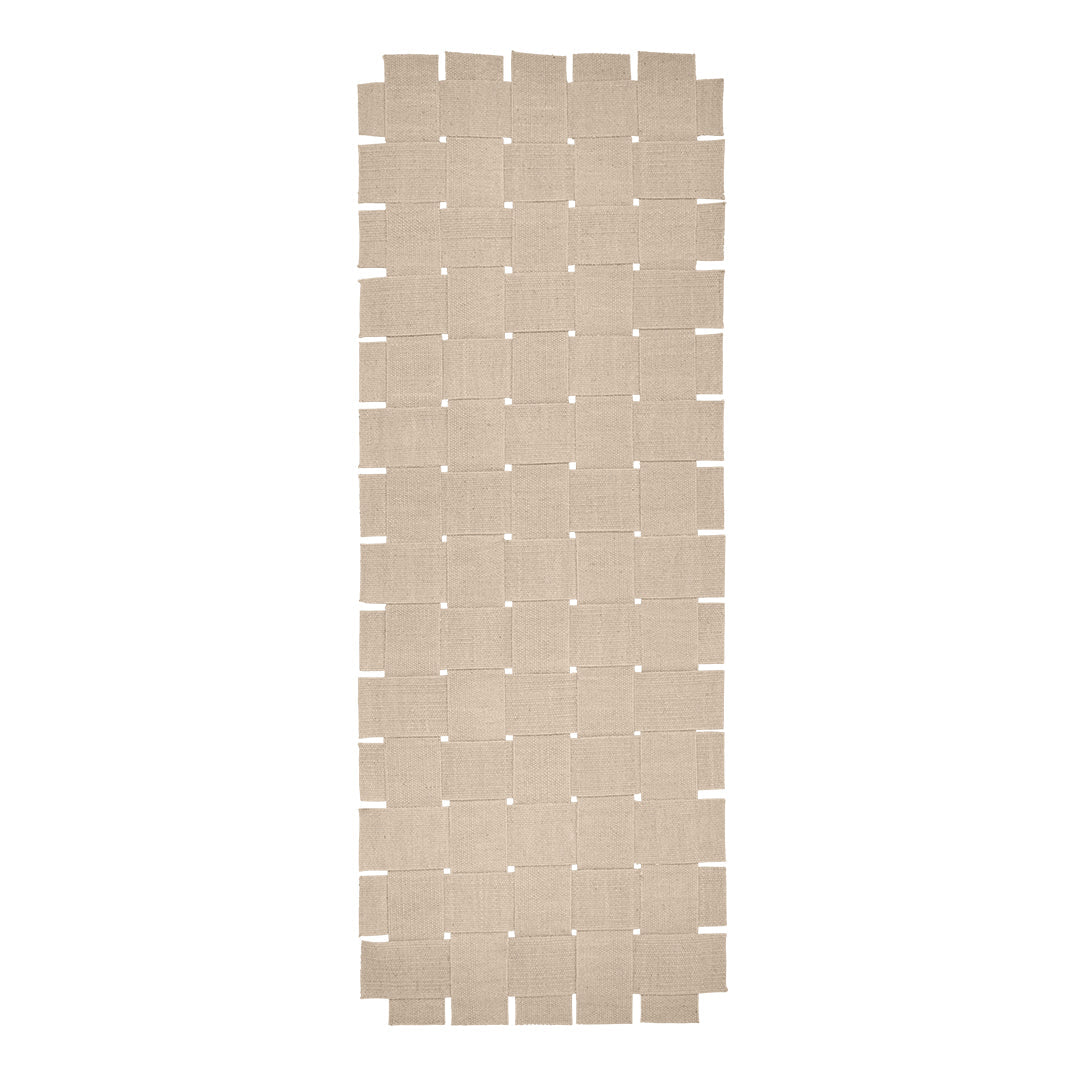 Beige interlocking mat with a grid pattern and small holes, perfect for versatile flooring solutions.