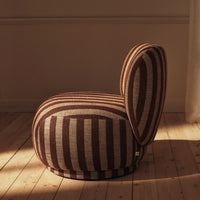Brown and beige striped chair with rounded shapes, showcasing a modern design and textured fabric patterns.