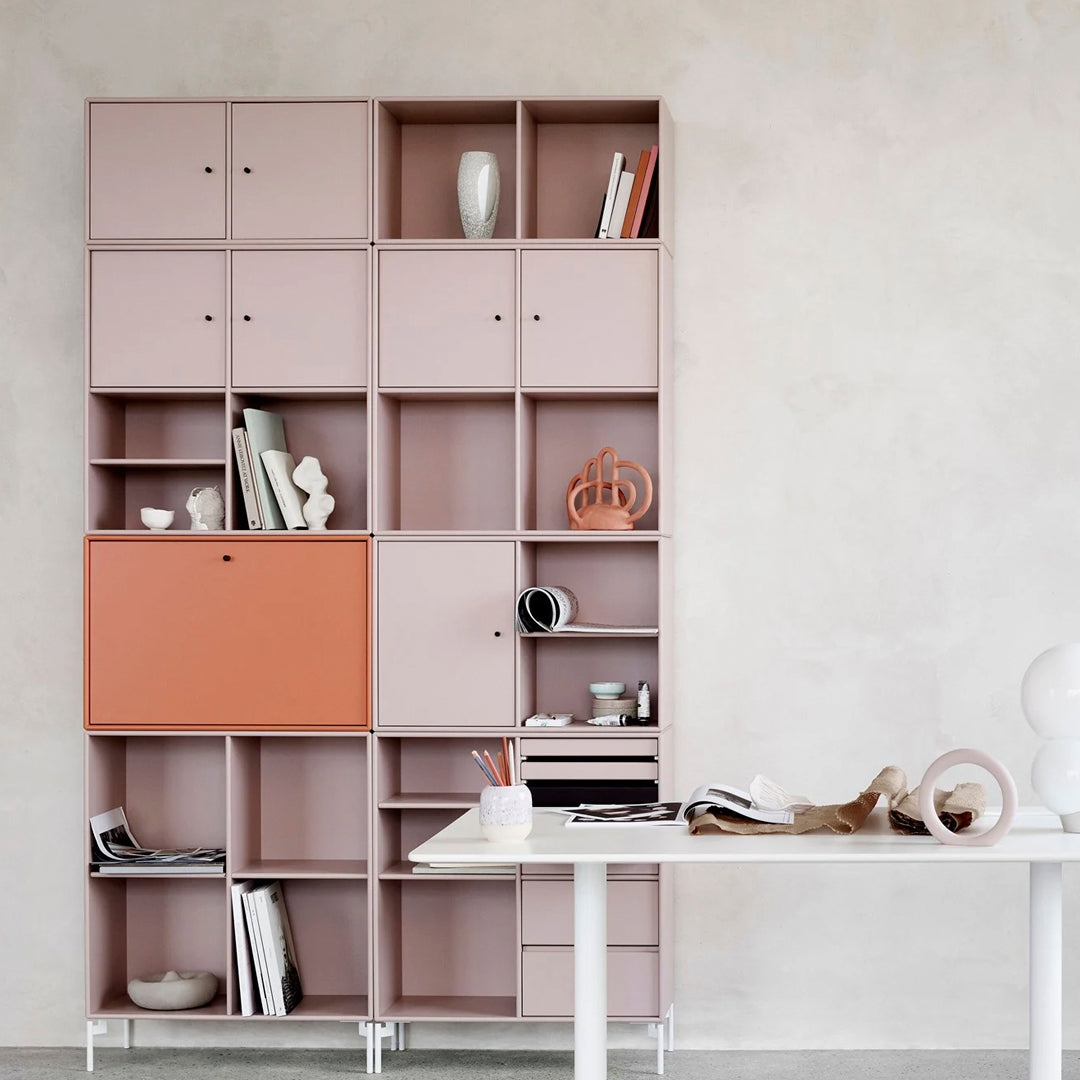 Modern shelving unit in soft pink and terracotta hues with geometric patterns, perfect for stylish organizing.