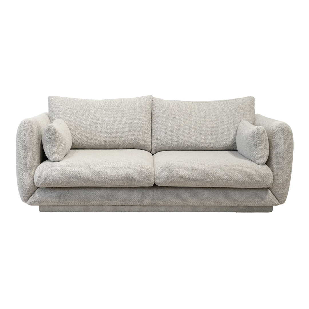 Textured light gray sofa with soft curves and plush cushions, perfect for modern living rooms.