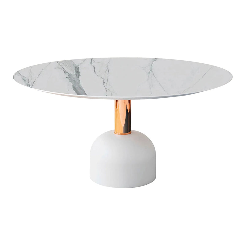 Round white marble dining table with gray veining and a sleek golden copper pedestal base. Modern and elegant design.