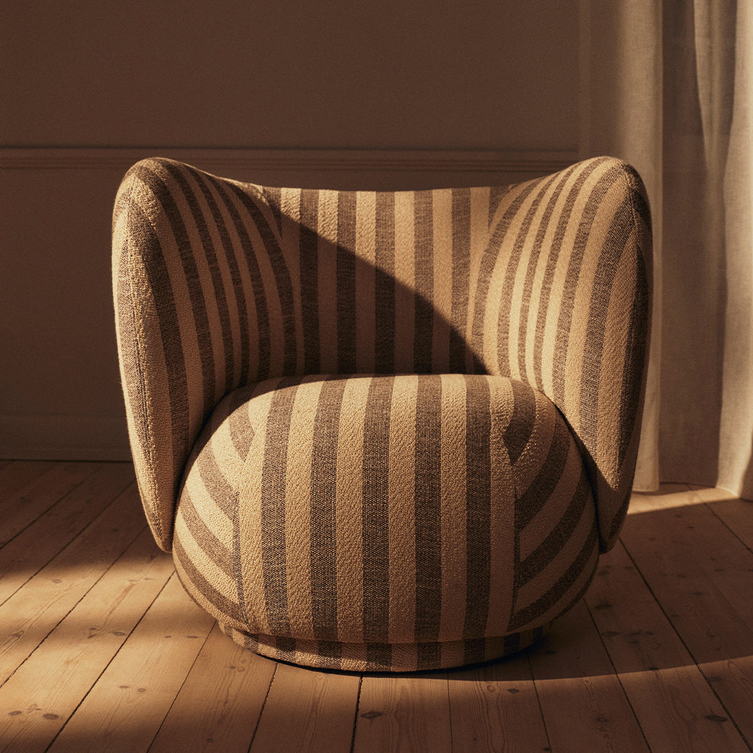 Beige and brown striped chair with rounded design, enhancing modern decor and inviting comfort.