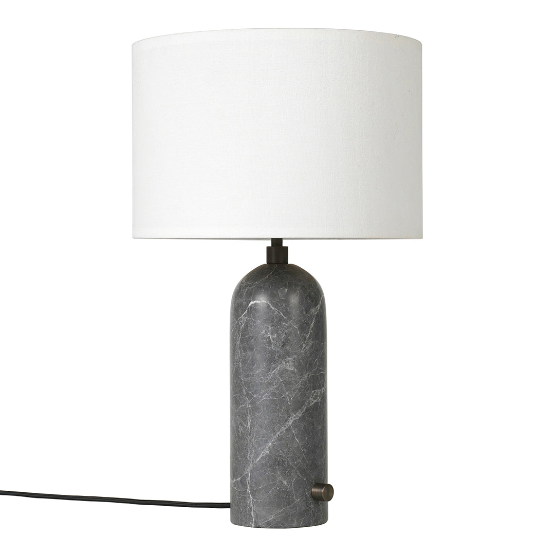 Gray marble lamp base with a white cylindrical shade, featuring a sleek, modern design. Perfect for contemporary decor.