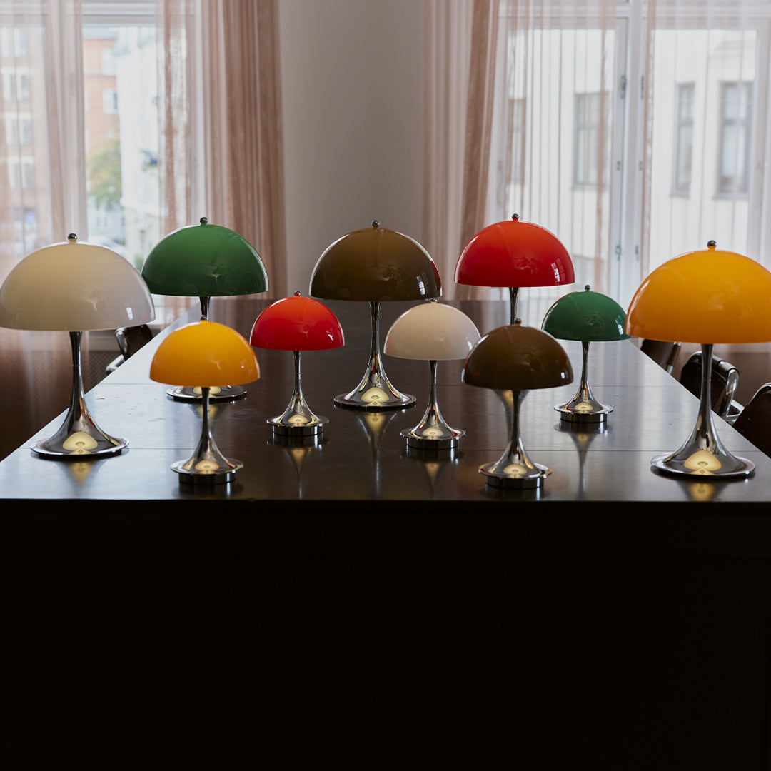 Colorful table lamps in red, green, yellow, and white with glossy finishes and sleek metal bases. Ideal for modern decor.