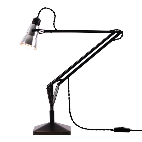 Modern black desk lamp with a sleek design and adjustable arms, featuring a silver shade and a textured cord.