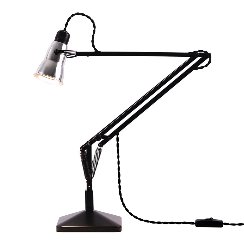 Modern black desk lamp with a sleek design and adjustable arms, featuring a silver shade and a textured cord.
