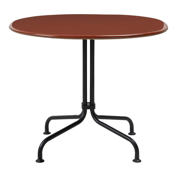 Round table with a glossy rust-colored top and black metal legs, perfect for modern dining spaces.