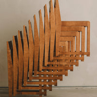Wooden geometric shelves in a warm, rich brown finish, featuring a modern zigzag pattern.