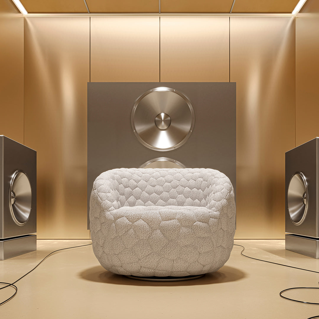 White quilted chair surrounded by metallic accents and a warm gold background, creating a modern, stylish look.