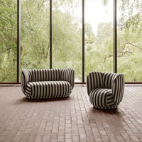 Black and white striped sofa set with soft, rounded shapes against a natural backdrop.