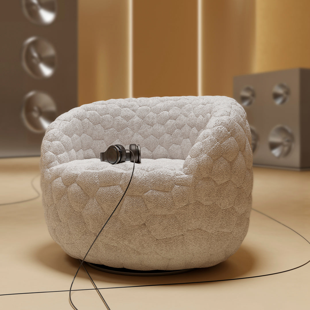 Textured white honeycomb-patterned chair with soft, plush fabric. Ideal for modern home decor.