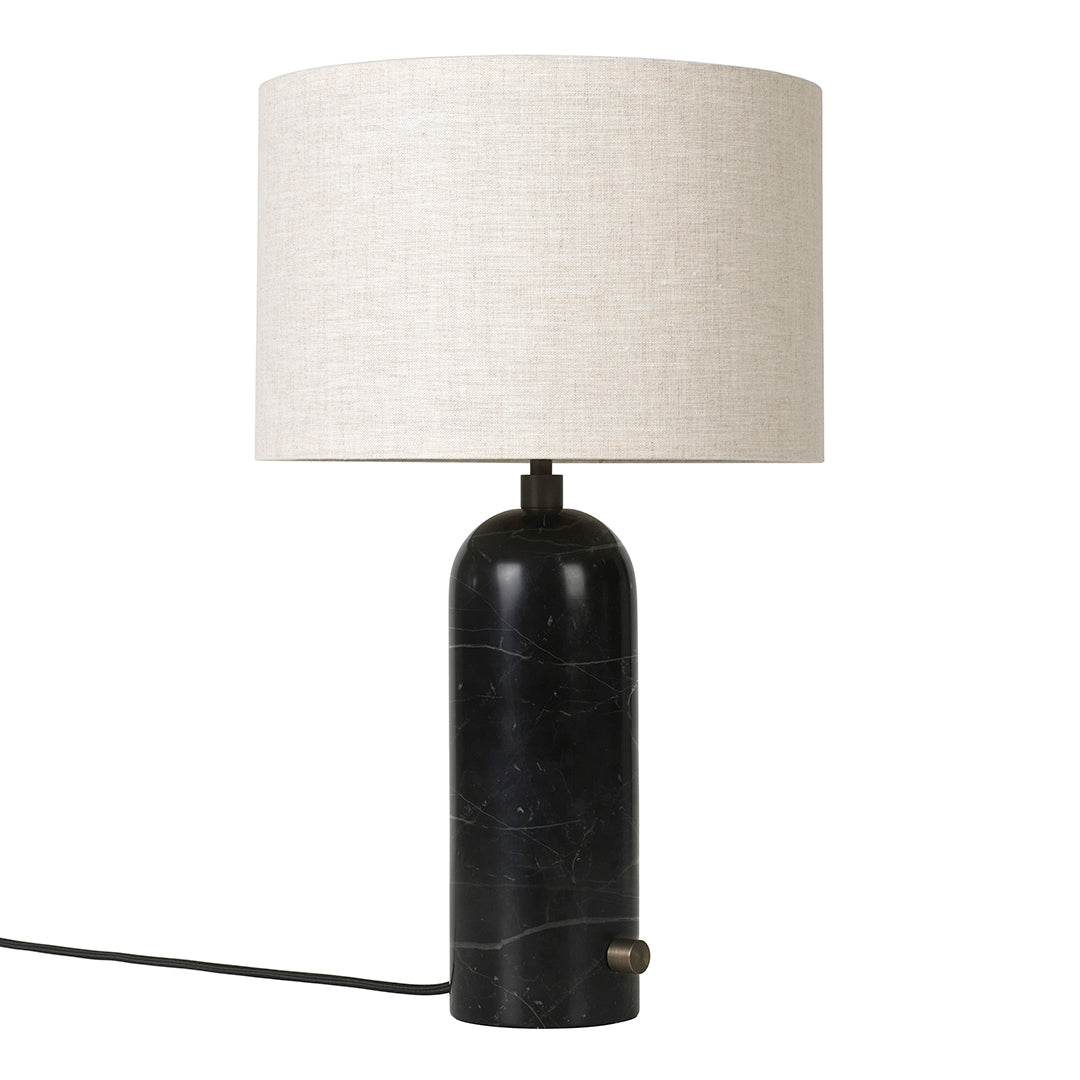 Black marble lamp base with a cream linen shade, featuring a sleek, modern design and minimalist aesthetic.