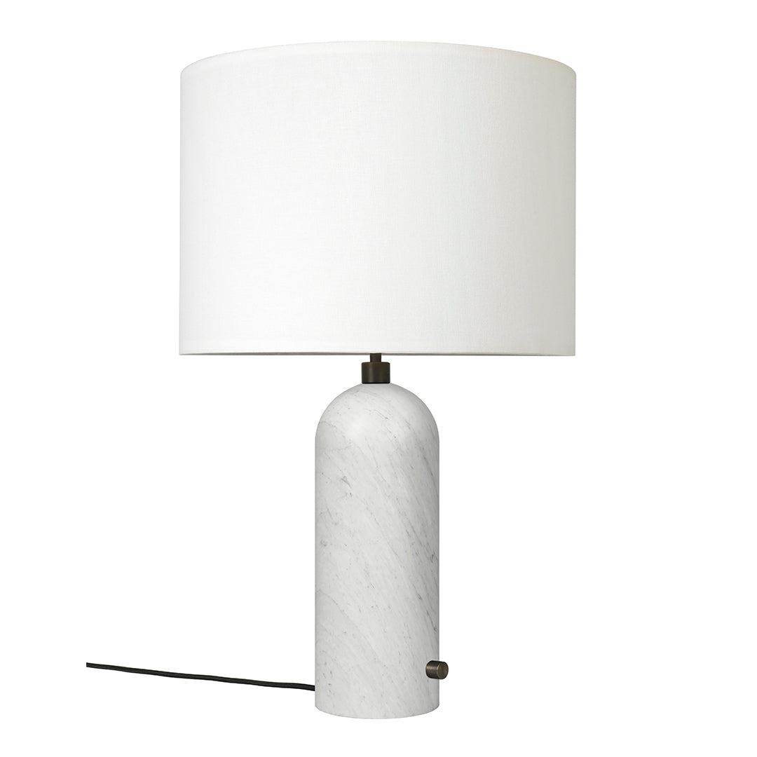 White marble lamp with a smooth, rounded base and a clean white drum shade, offering a modern aesthetic.