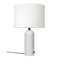 White marble lamp with a smooth, rounded base and a clean white drum shade, offering a modern aesthetic.