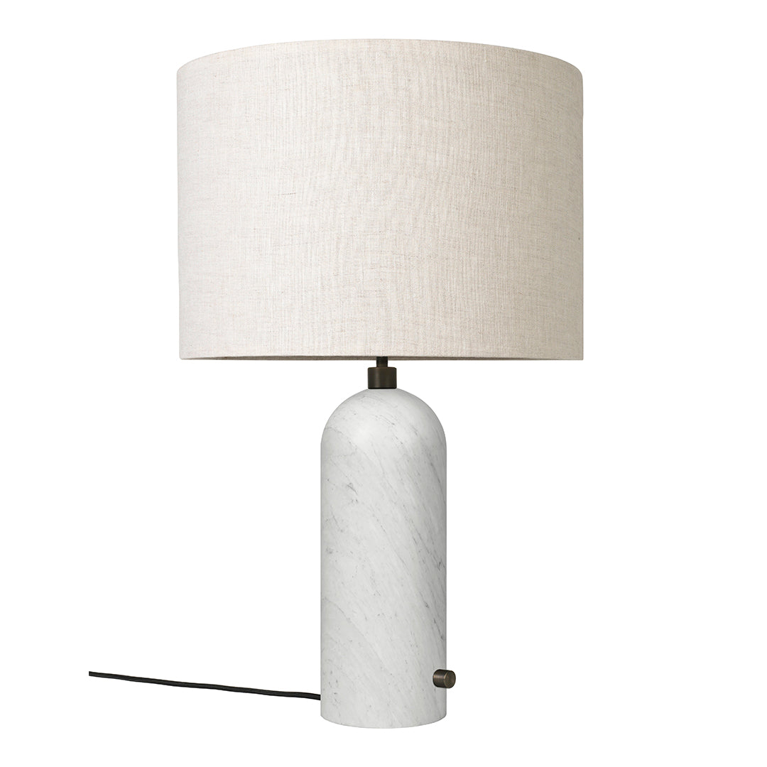 White marble lamp base with a textured beige linen shade. Elegant and modern design for any decor.