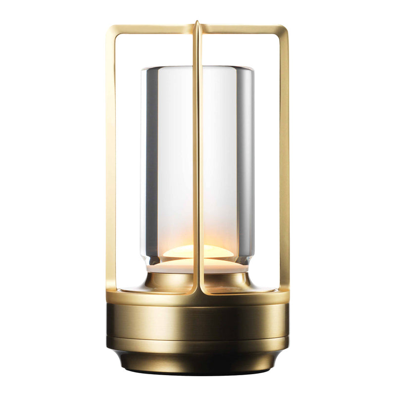Elegant gold lantern with a clear glass shade, featuring a warm amber glow at the center. Ideal for modern decor.