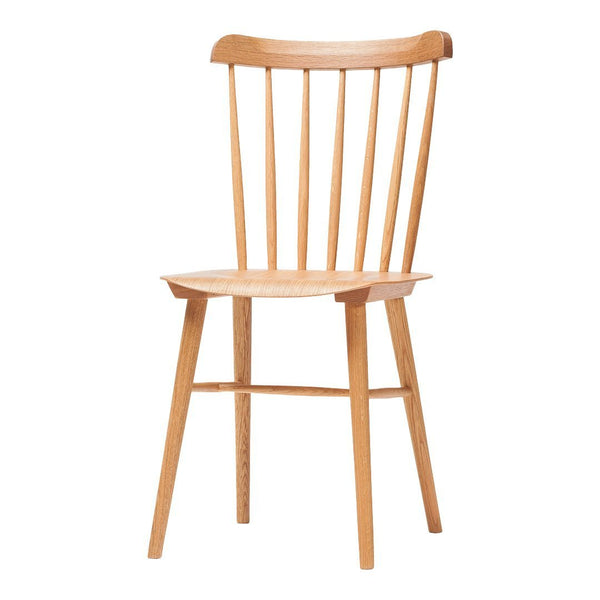 Light wood dining chair with a classic spindle back design and natural finish, showcasing clean lines and minimalist style.