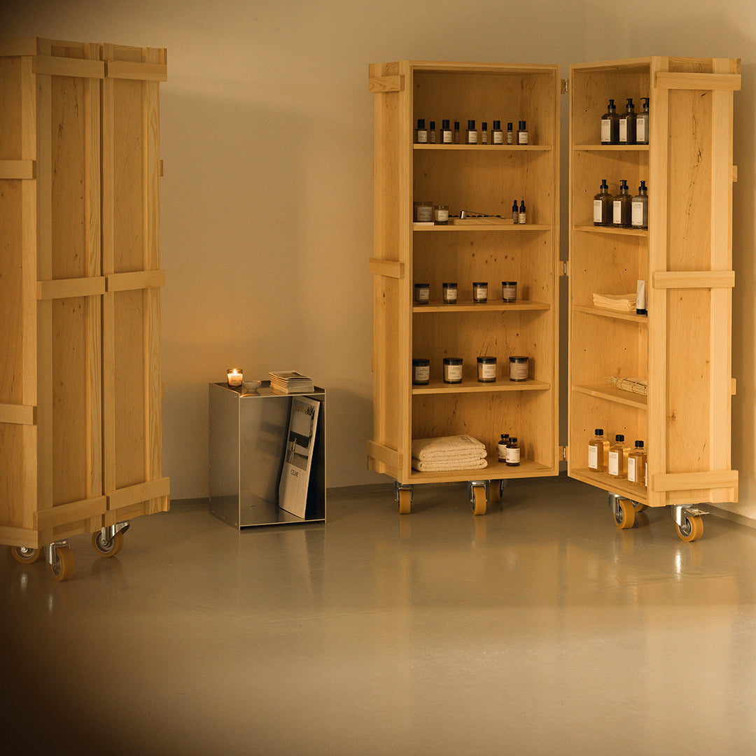 Natural wood finish cabinets on wheels, featuring warm beige tones and minimalistic design, enhancing a calm aesthetic.