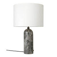 Gray marble lamp base with a sleek white cylindrical shade and minimalist design. Perfect for modern decor.