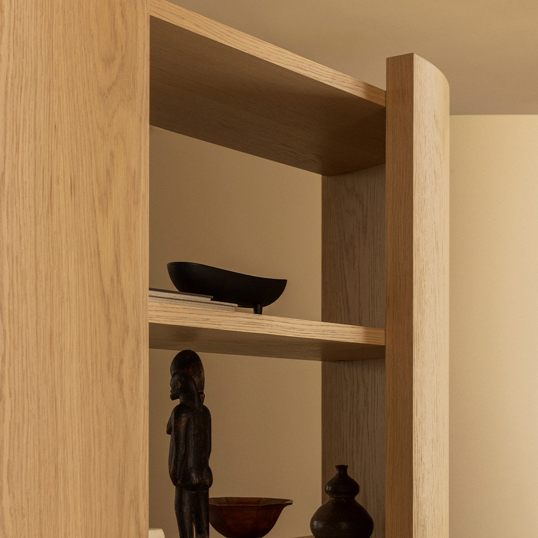 Natural oak wood grain with smooth, rounded edges; minimalistic design featuring dark decorative accents.